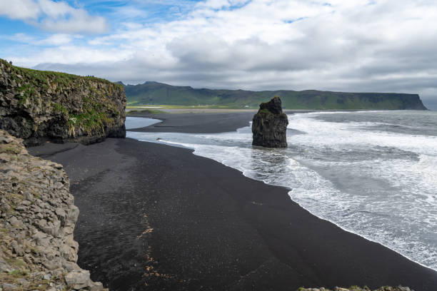 istock Dyrholaey area in Iceland with sea stacks and black sand beach 1817007473