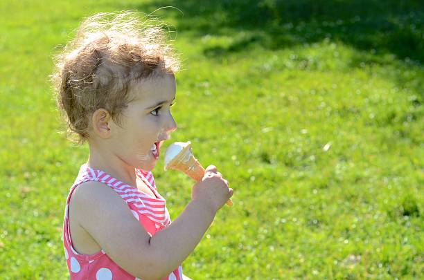 istock Pretty young child eating ice cream 181702058