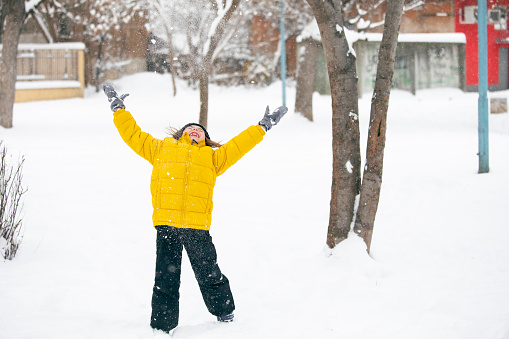 funny teenager girl portrait with the snow on the hair. Winter, outdoor, daylight. 