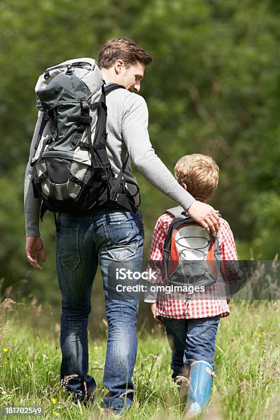 Father And Son Hiking In Countryside Stock Photo - Download Image Now - Child, Father, Offspring