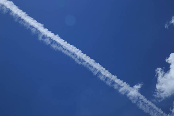 istock Trace of an airplane in blue sky 181702935