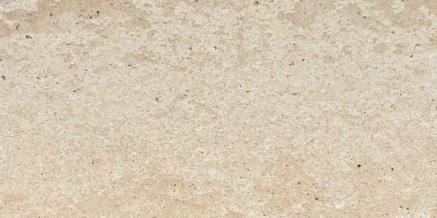 Natural travertine in beige color, background pattern.