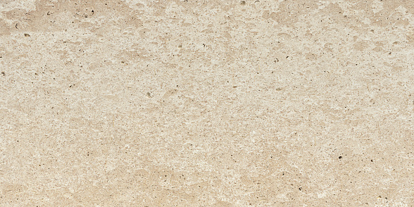 Natural travertine in beige color, background.