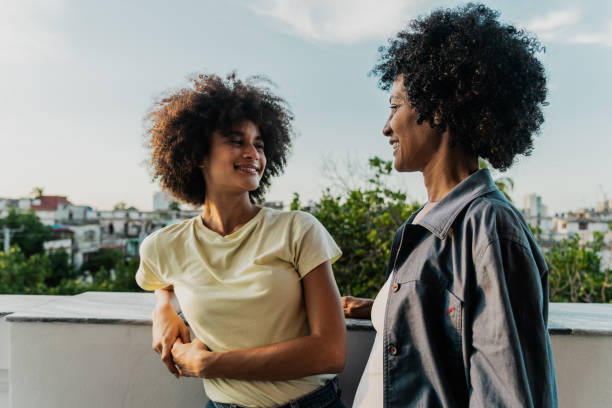 istock Mother and daughter talking on the balcony 1817041141
