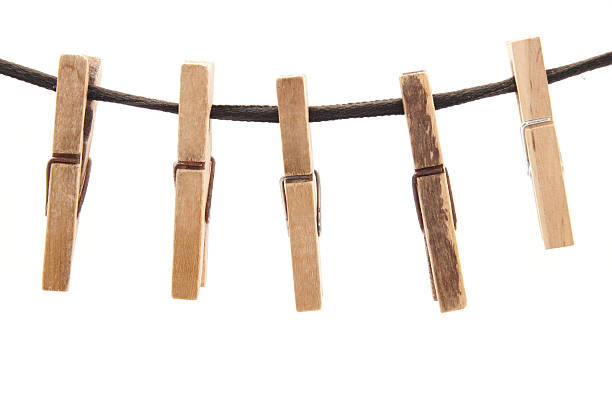 istock Clothespins and rope on a white background 181704761