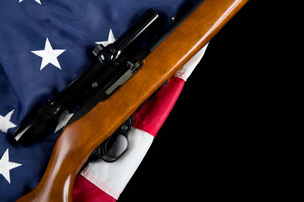 istock Semi automatic rifle with telescopic site on American Flag 1817050601
