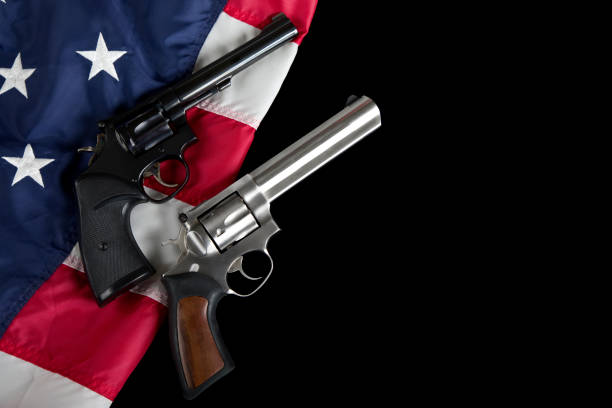 istock Revolvers rest on American Flag background 1817050602