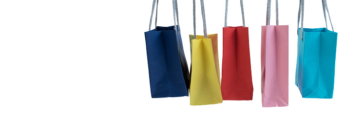 Paper shopping bags with handles on white background. Mockup for design. panorama