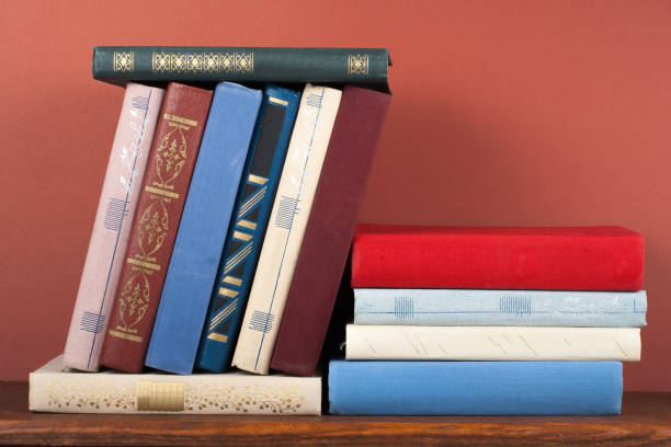 istock Open book, hardback colorful books on wooden table. Back to school. Copy space for text. Education business concept. 1817075293