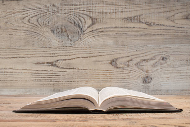 open book. Composition with hardback books, on wooden background. Books stacking. Back to school. Copy Space. Education background