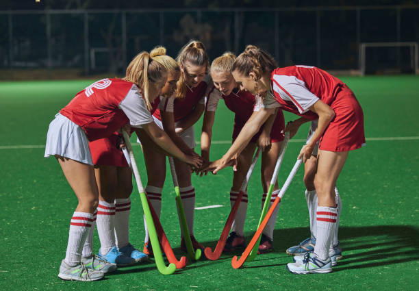 istock Hockey, together hands and women teamwork, support or  motivation for game, competition or training strategy communication. Leadership, sports and group hand stack circle in target goal collaboration 1817091554