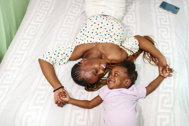 Joyful African Mother and Daughter Sharing a Tender Moment at Home