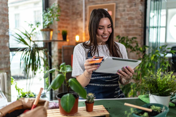 istock Young woman using digital tablet for online payment 1817110006