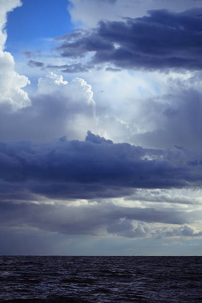 istock Cloudy dark sky above a surface of the sea 181711259