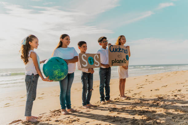 istock Children protesting to save planet Earth on the beach 1817128855