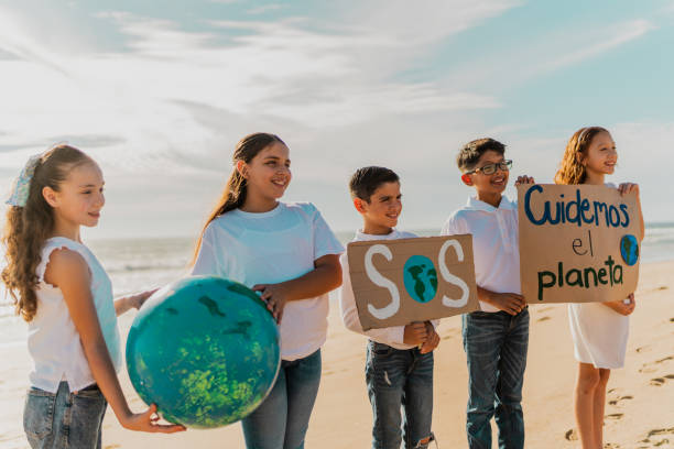 istock Children protesting to save planet Earth on the beach 1817128863