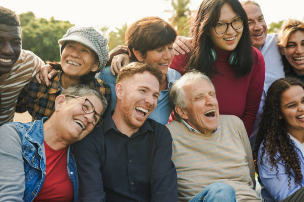 istock Crowd of multi generational people having fun together at city park - Multiracial community concept 1817129909