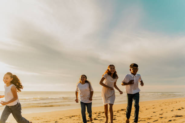 istock Happy kids running on the beach 1817130617