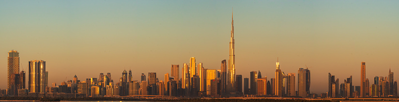 Burj Khalifa and other skyscrapers at sunrise in Dubai, UAE.