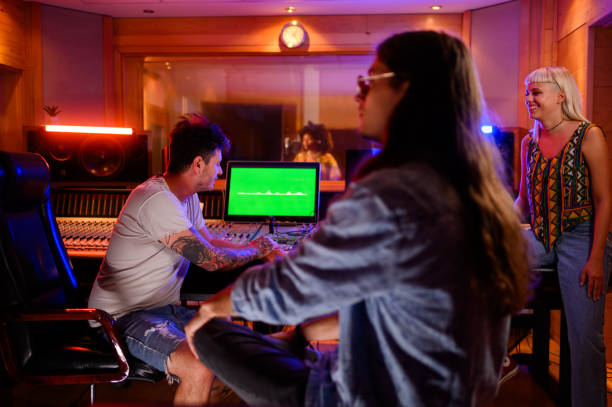 istock A recording session in a studio, band members are taking a break. 1817142309