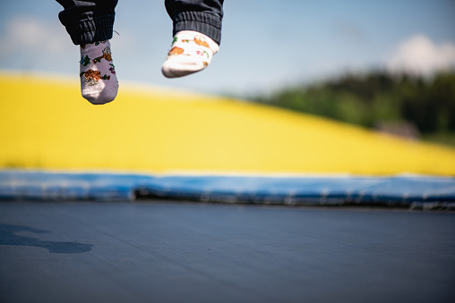 Children jumping on a trampoline and have some fun