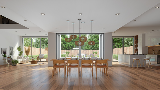 Modern Living Room With Wooden Dining Table, Chairs, Open Plan Kitchen And Garden View Through The Window