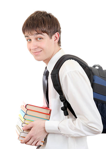 Student with Knapsack Holding the Books Happy Student with Knapsack Holding the Books Isolated on the White Background late teens isolated on white one person cute stock pictures, royalty-free photos & images