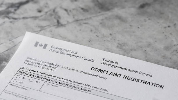 istock Canada Occupational Health and Safety Complaint Form with Pen 1817162005