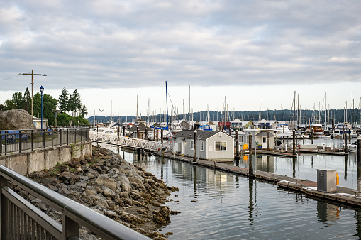 Poulsbo, Washington - May 29, 2023: Poulsbo Marina sits on Liberty Bay. Poulsbo is a Scandinavian themed town founded by Norwegian immigrant Jørgen Eliason.
