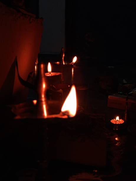 istock lit candles in a dark room are placed on a table 1817172623