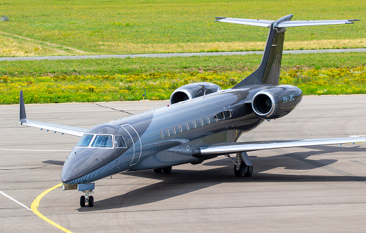 Embraer Legacy 600 business jet from JetNetherlands arricing at Eindhoven Airport. Eindhoven, The Netherlands - July 3, 2020