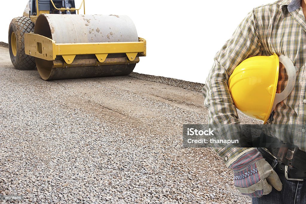 driver and soil compactor during road construction work on white driver and soil compactor during road construction work on white background with clipping path Asphalt Stock Photo