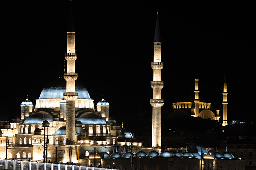The Yeni Camii, the New Mosque in Eminönü at night time, Istanbul - Turkey.