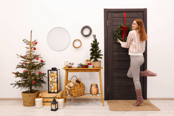 istock Woman decorating her entry way for Christmas 1817216507