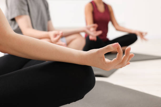 istock Group of people practicing yoga on mats indoors, closeup 1817219171