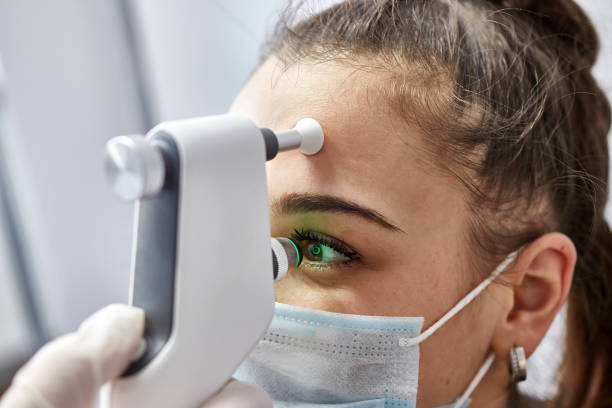 Beautiful girl measures eye pressure