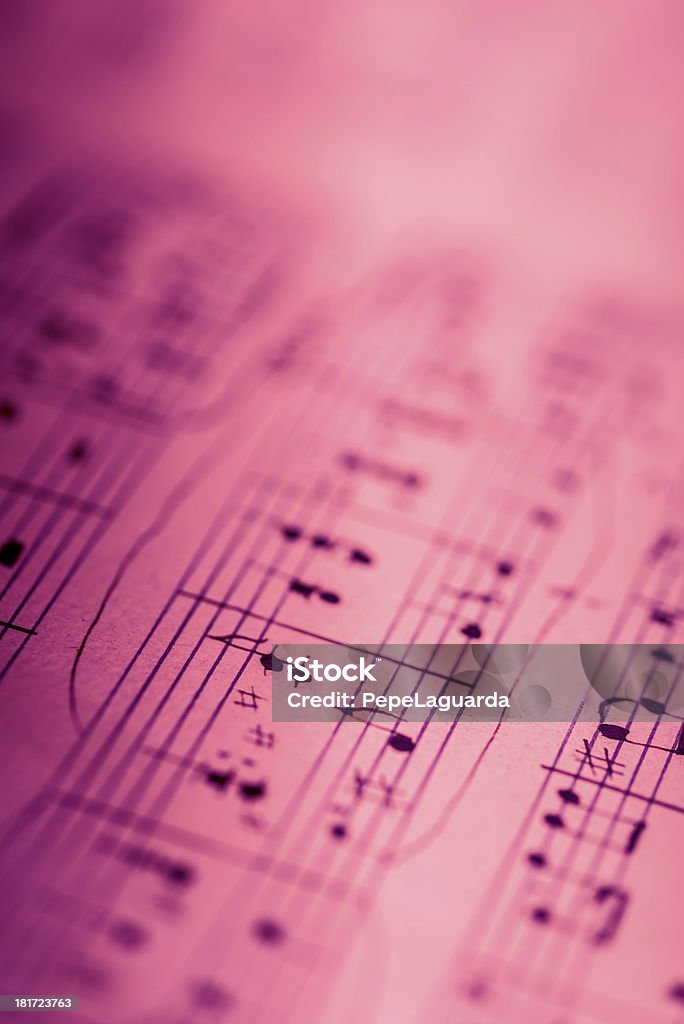 Musical composition Sheet music in pink. Musical Note Stock Photo