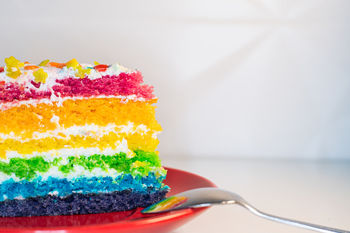 Rainbow cake on white background - Vintage filter and sunflare effect