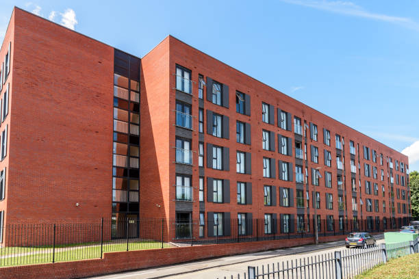 istock Modern brick apartment building in a housing development on a sunny summer day 1817286362