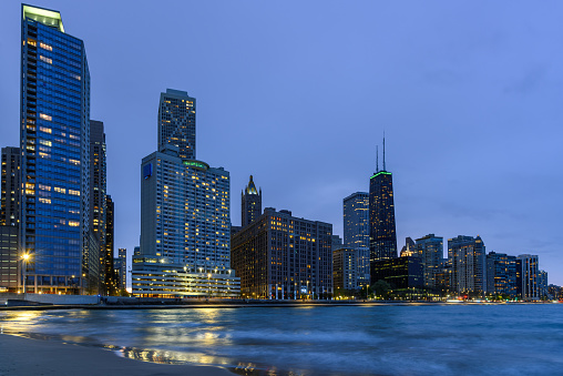 Magnificent view of Chicago skyline from the shore of Lake Michigan at twilight in spring. Illinois, USA.