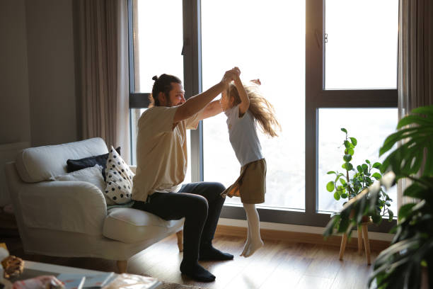 istock Little Girl Having Fun With Her Father At Home 1817294773