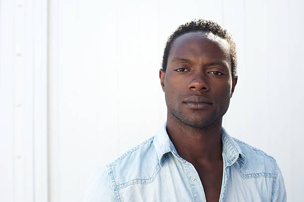 istock Portrait of a handsome black man against white background 181730804