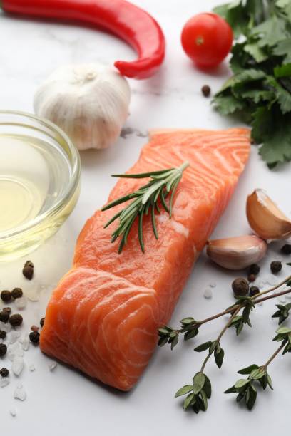 istock Fresh salmon and ingredients for marinade on white marble table 1817310653