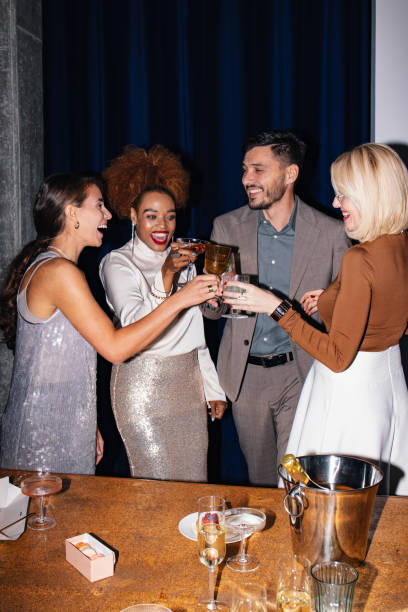 istock Group of Friends Celebrating With Drinks at a Party 1817312304