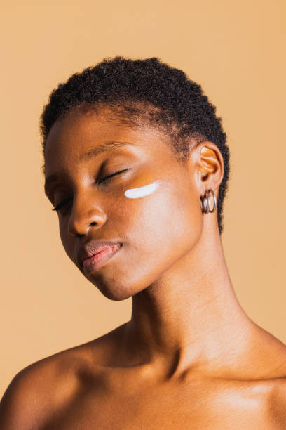 istock Young woman with cream on her face. 1817340017