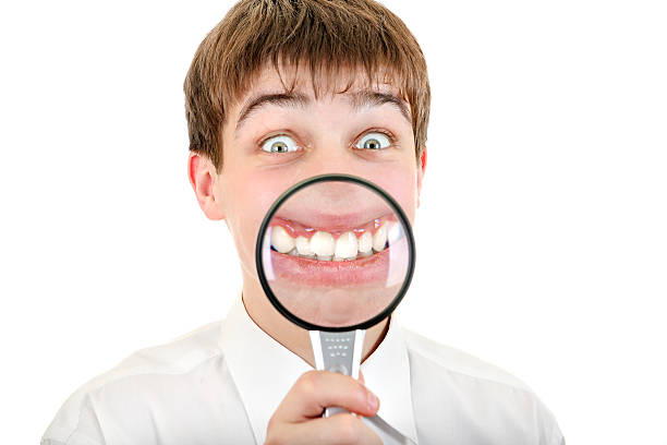 istock Funny Teenager with a Loupe 181735095