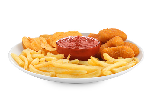 Tasty french fries, chicken nuggets and chips served with ketchup isolated on white