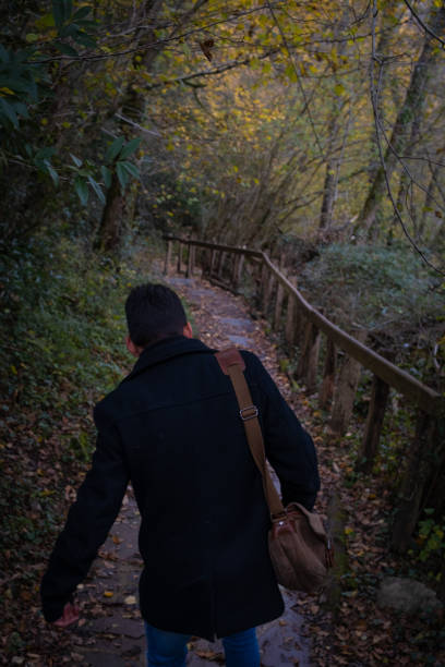 istock Autumn trail, unrecognizable youth with bag. 1817374417