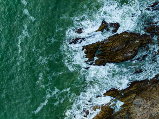 istock Bird eye view seashore with big wave crashing on rock cliff. Beautiful waves sea surface in sunny day summer background, Amazing seascape top view seacoast landscape view 1817407827