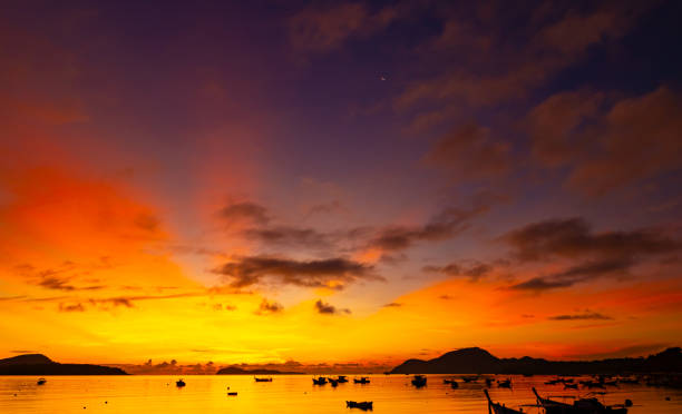 istock Beautiful colorful sunset or sunrise sky over sea with dramatic clouds nature environment background 1817429816